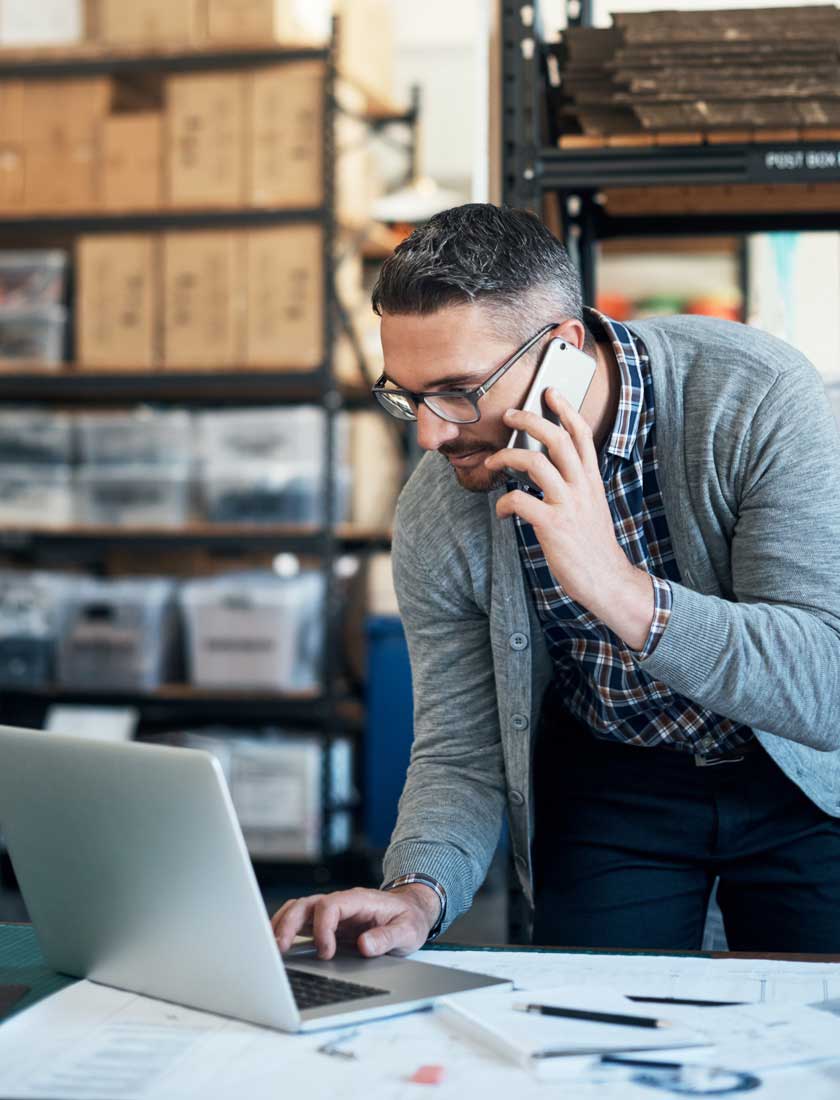 small business employee reviewing his business account with free online banking